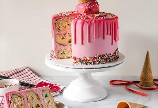 pink and white cake on white ceramic plate