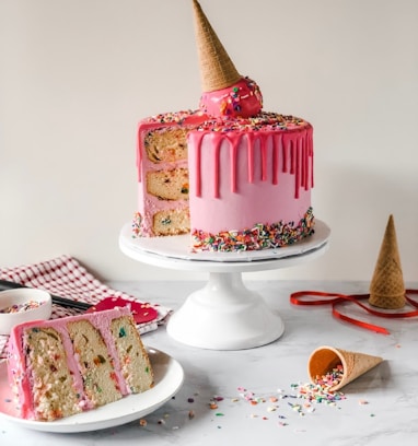 pink and white cake on white ceramic plate