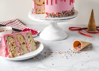 pink and white cake on white ceramic plate