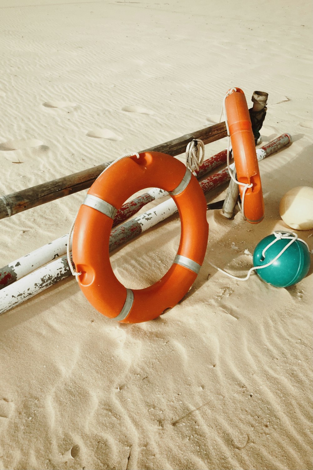 orange inflatable ring on sand