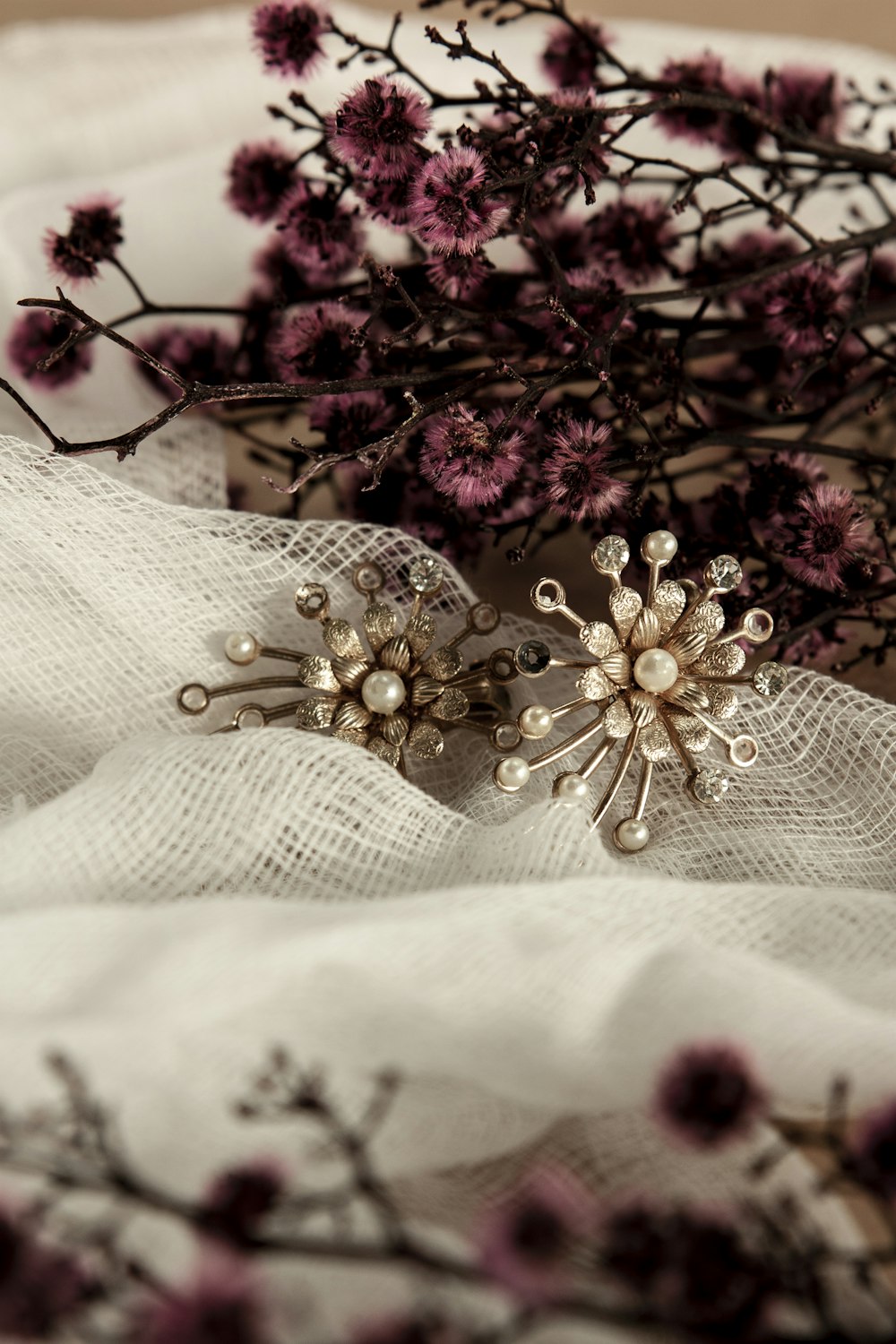 pink and white flowers on white textile