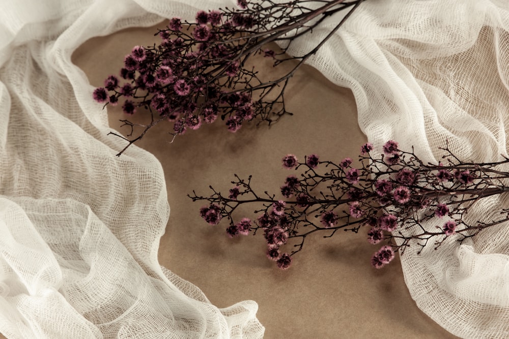 purple flowers on blue textile