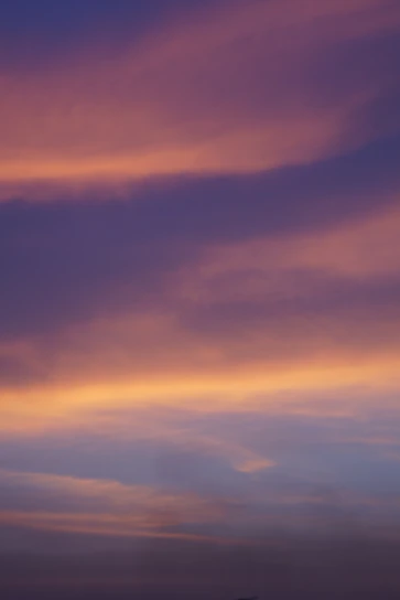 A serene purple and gold cosmic sky blending into a tranquil vastu-inspired home interior.