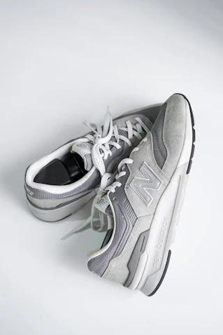 gray and white nike athletic shoe