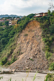 brown and white concrete building on hill