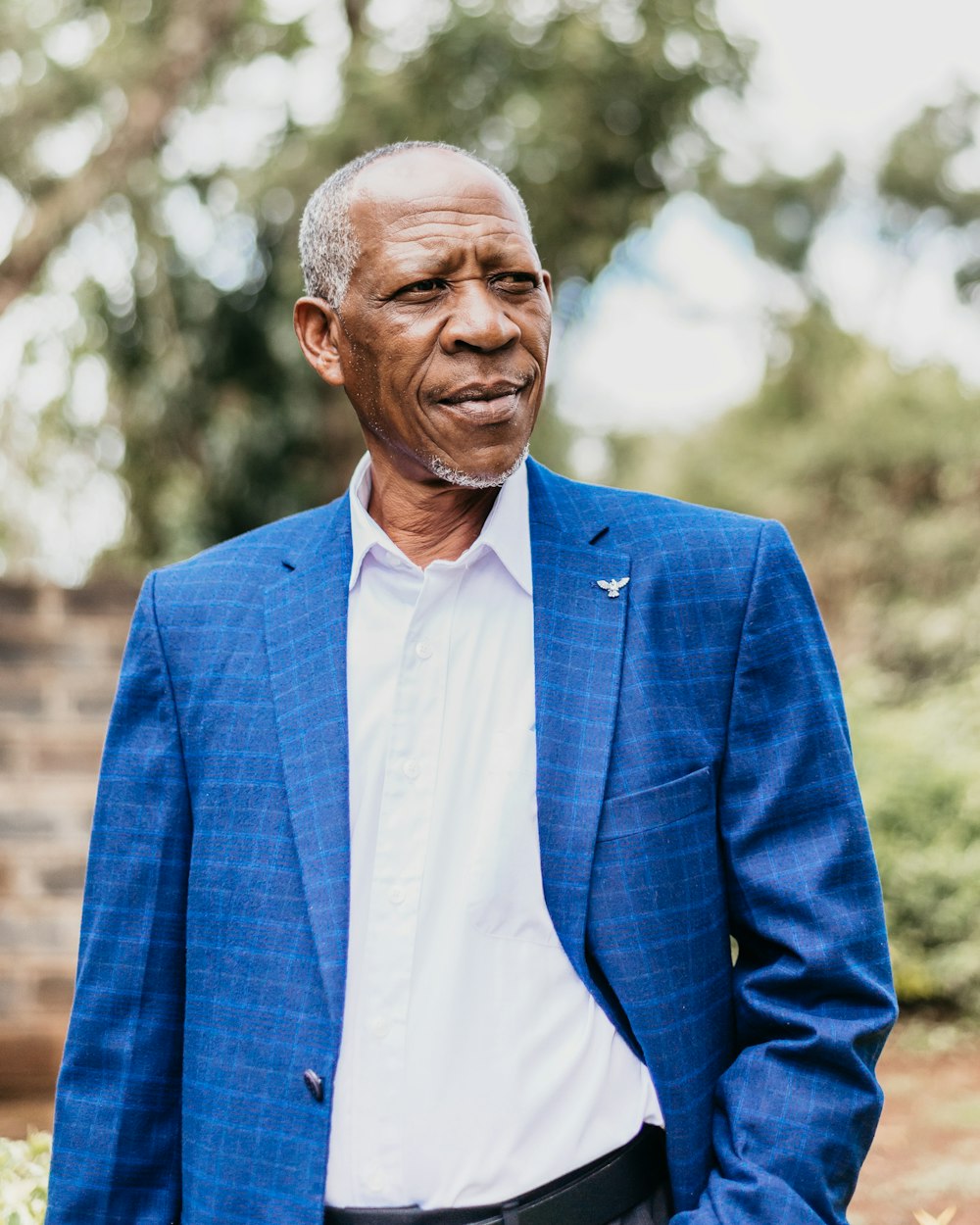 man in blue suit jacket and white dress shirt