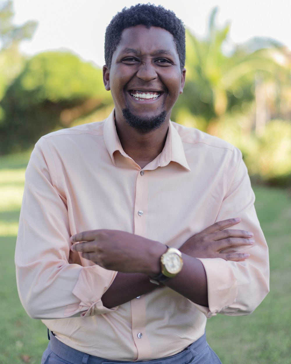 man in white dress shirt smiling