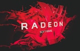 A bold and dynamic design featuring the word 'RADEON' prominently displayed in white text against a vibrant red background with abstract, fluid shapes.