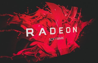 A bold and dynamic design featuring the word 'RADEON' prominently displayed in white text against a vibrant red background with abstract, fluid shapes.