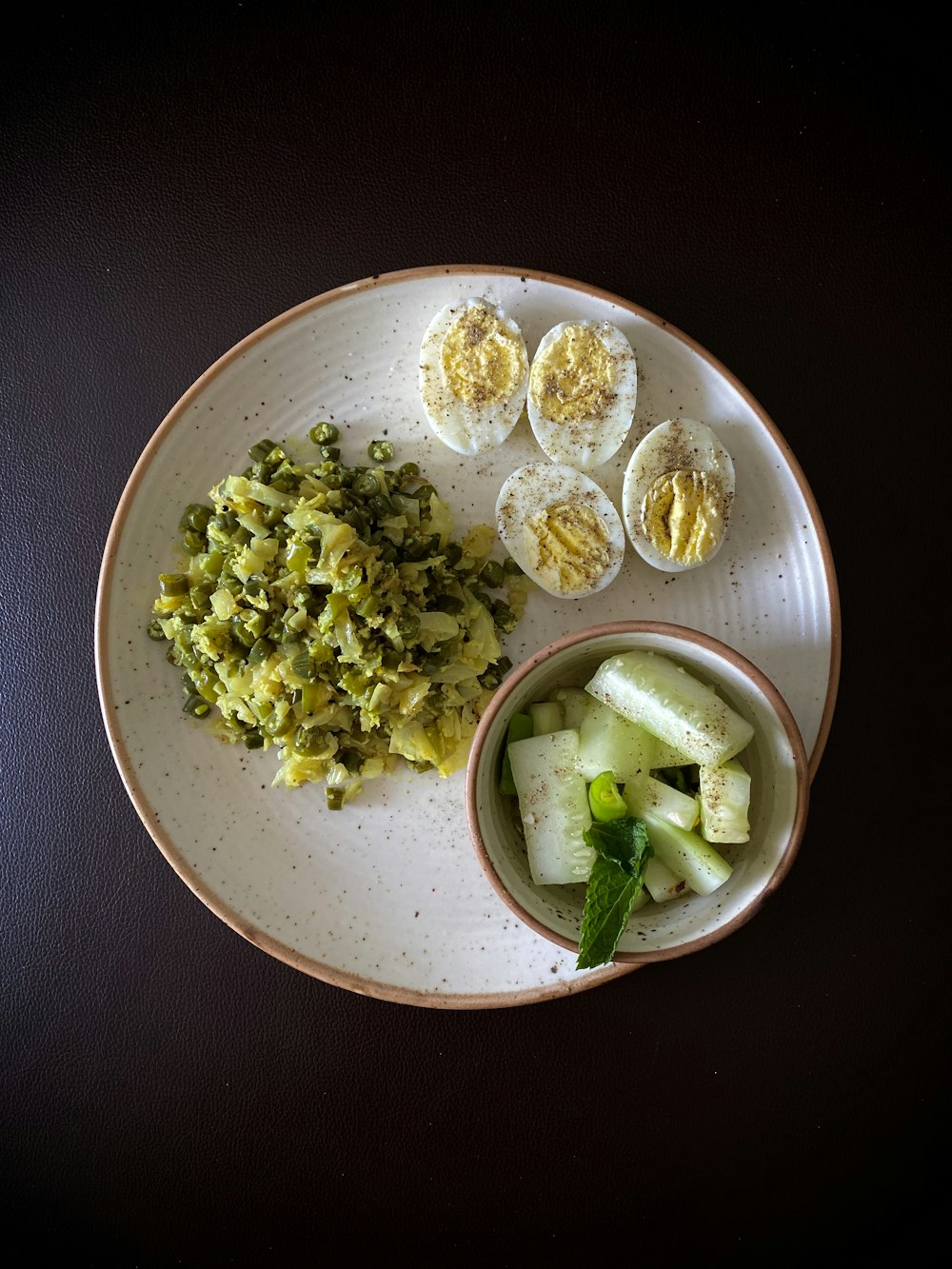 white ceramic bowl with rice and green vegetable