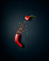 red chili pepper with green leaves