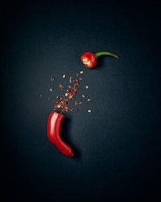red chili pepper with green leaves