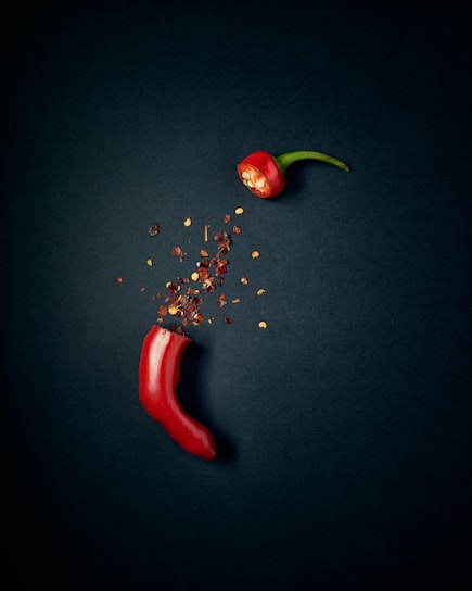 red chili pepper with green leaves