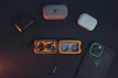 TunerTribe branded carrying cases and charging docks arranged neatly