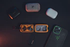 TunerTribe branded carrying cases and charging docks arranged neatly