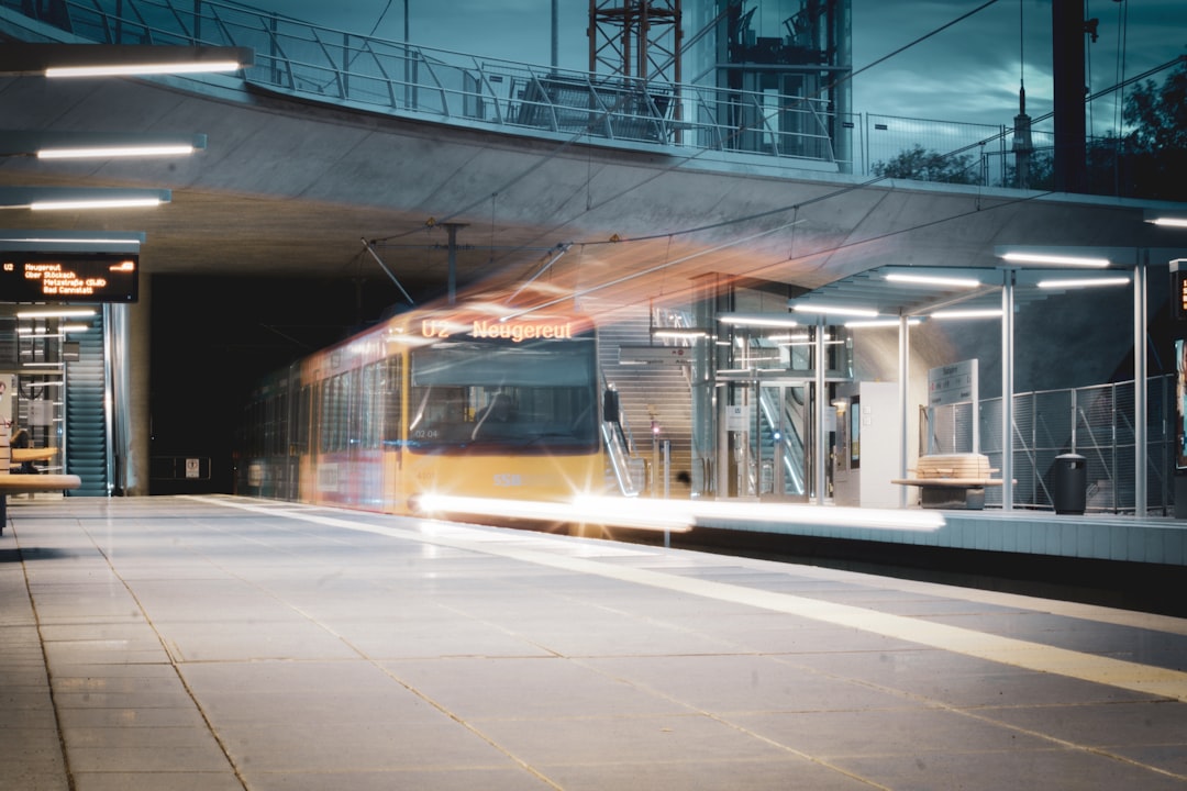 white and brown train on rail way during night time