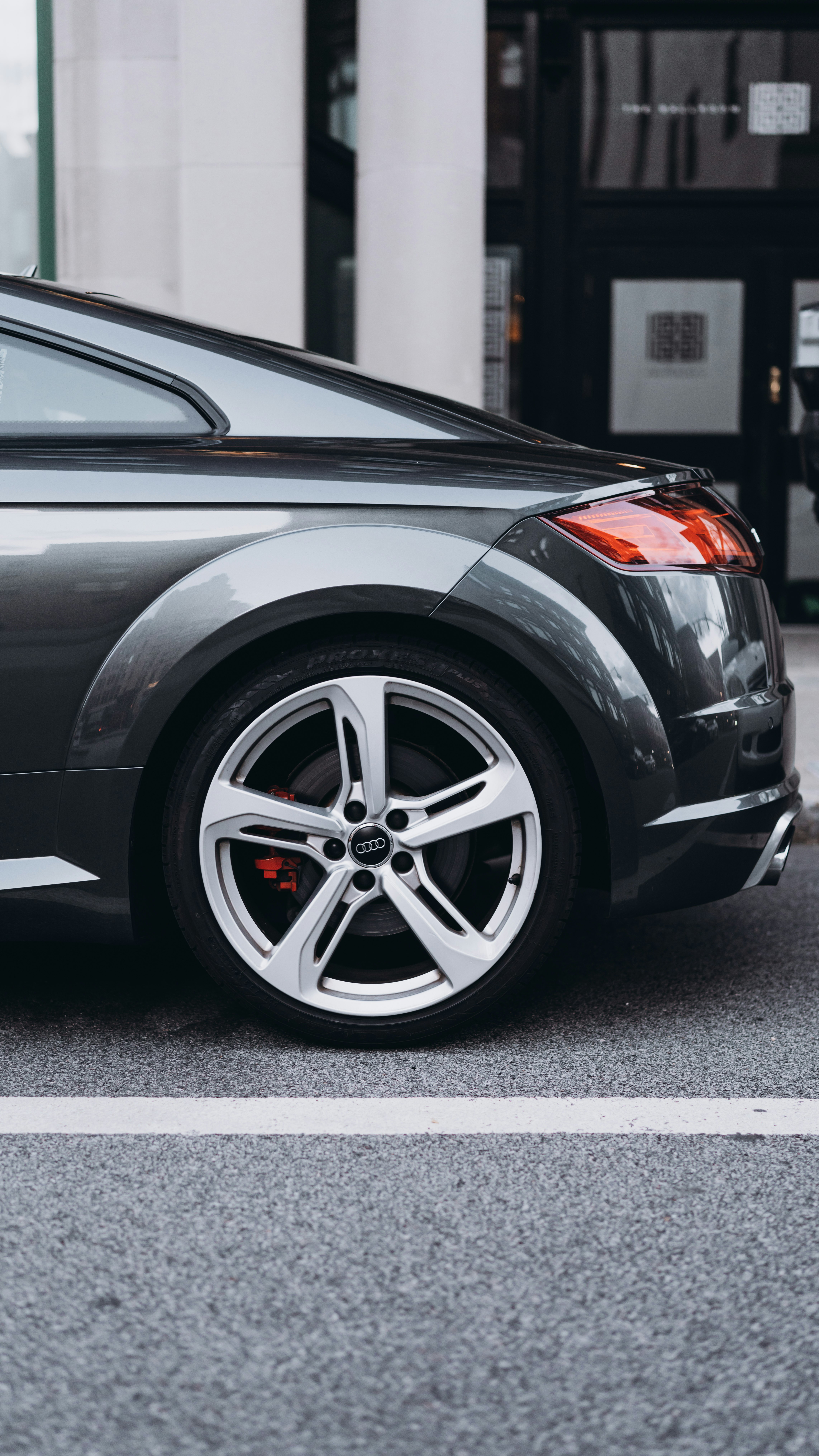 black car on gray asphalt road during daytime