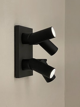 A close-up of a sleek LED spotlight on a wall.
