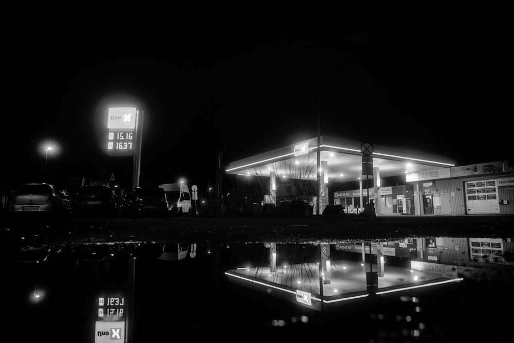 grayscale photo of city buildings during night time