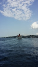 Aerial view of a modern ship navigating through calm waters.