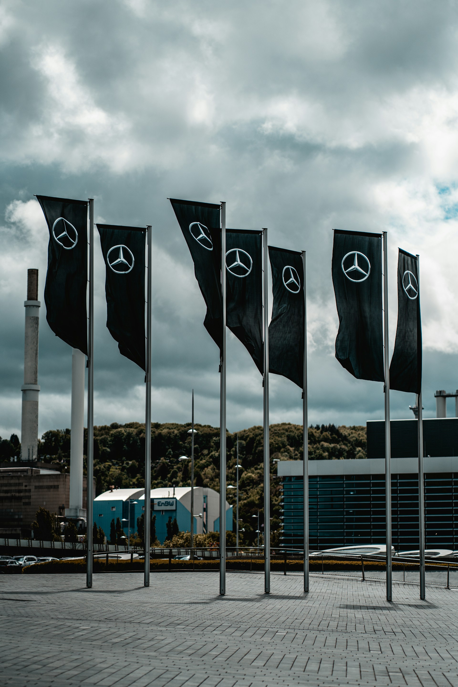 blue and white flags on poles during daytime