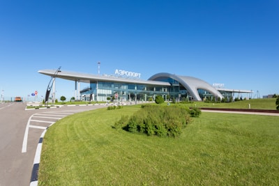 Stansted Airport's modern terminal building under a clear sky.