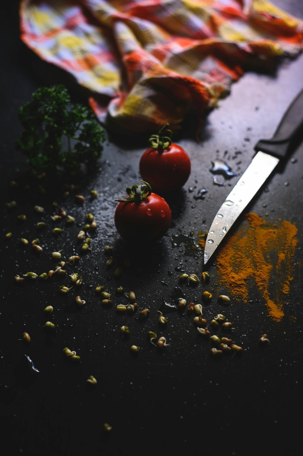 red and silver knife on black surface