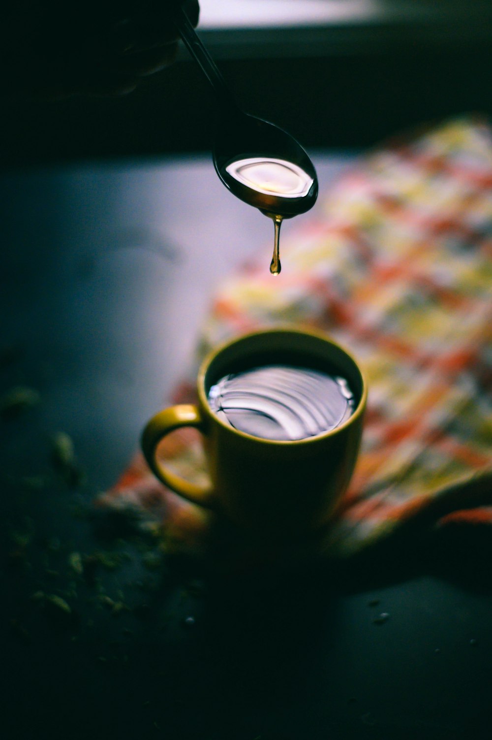 brown ceramic mug with coffee