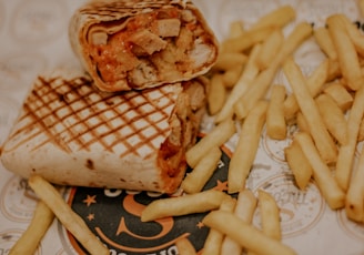 fries and burger on white ceramic plate