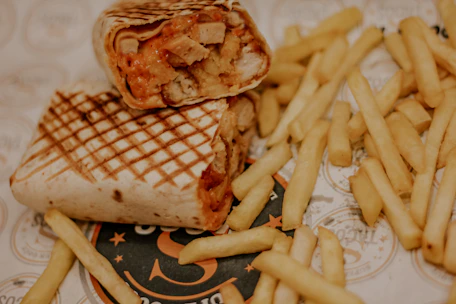 fries and burger on white ceramic plate