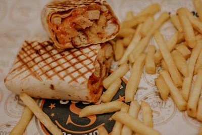 fries and burger on white ceramic plate