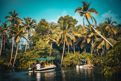white and blue boat on body of water during daytime
