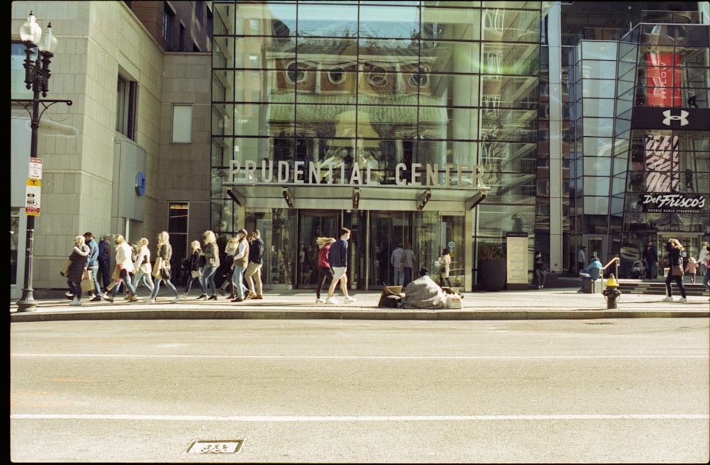 people walking on pedestrian lane near building during daytime