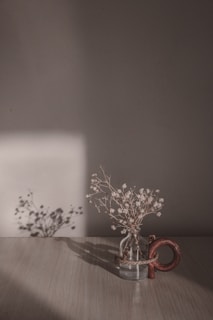white and brown floral candle holder