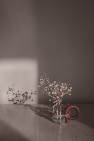 white and brown floral candle holder