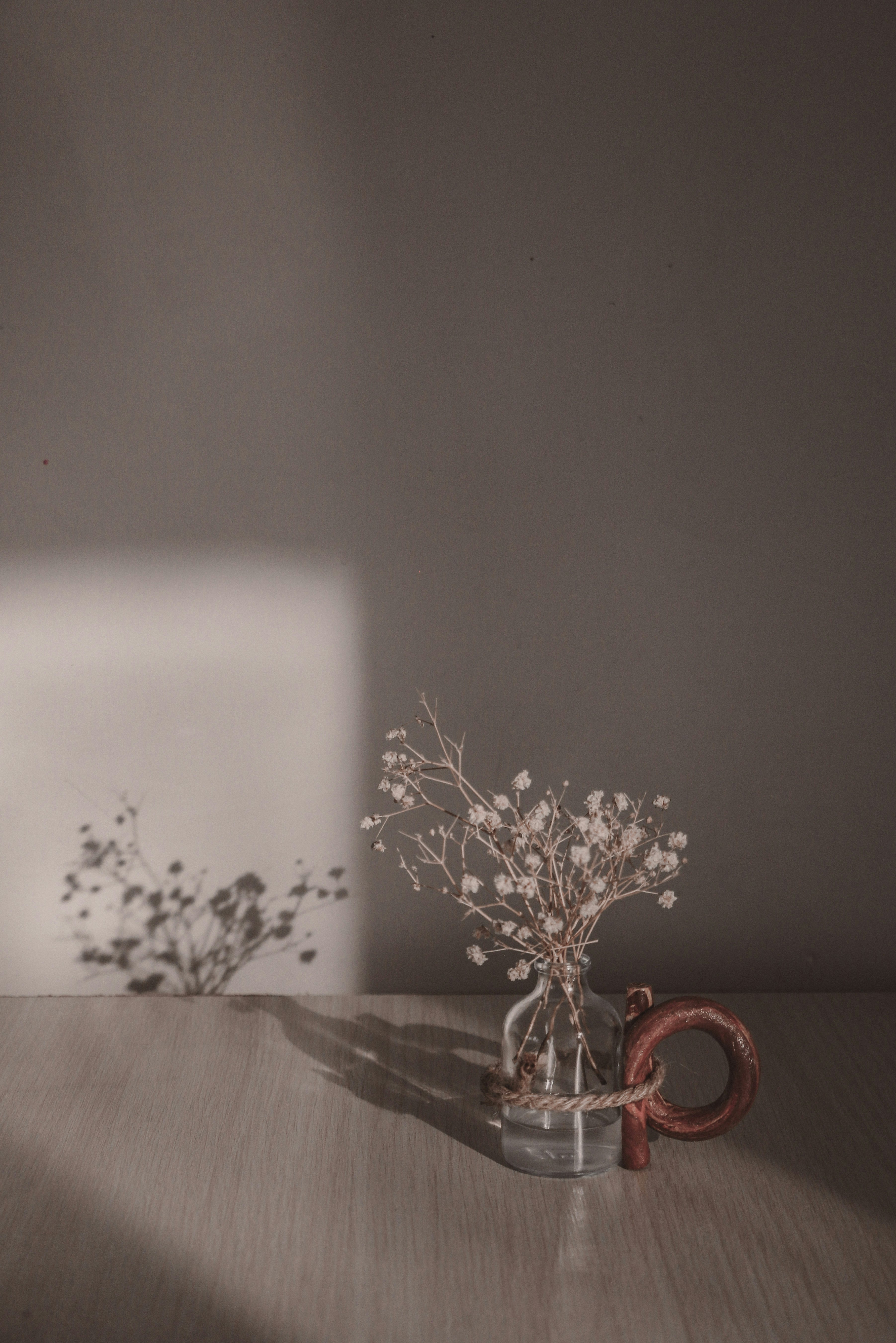 white and brown floral candle holder