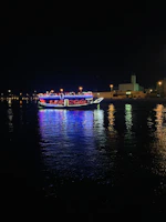 Underwater LED lighting illuminating a yacht hull at dusk