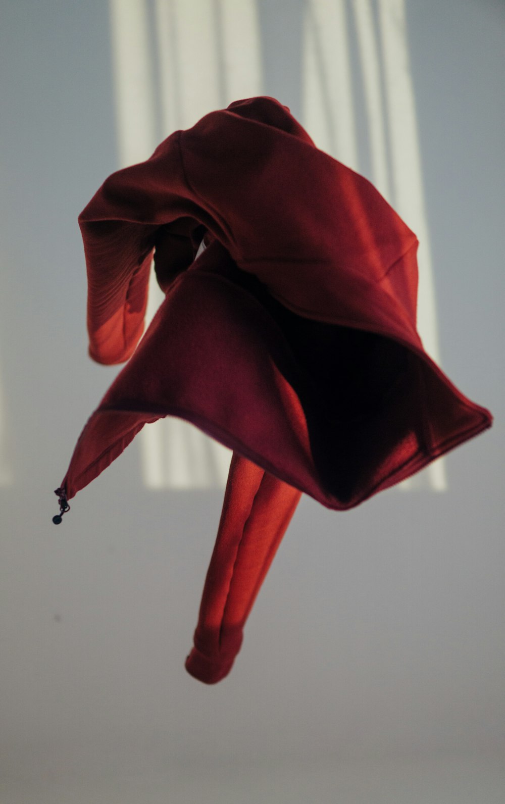 red textile on white wall