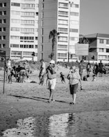 A lively beach scene with customers enjoying ice cream near the sandy shore at noilli.