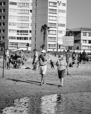 A lively beach scene with customers enjoying ice cream near the sandy shore at noilli.