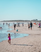 A group of tourists enjoying the beach activities in Zapponeta.