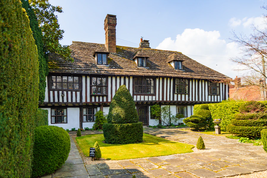 English Tudor estate with half-timber facade and topiary garden — Greenwich