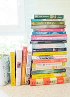 A stack of books sitting on top of a counter