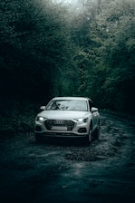 white audi car enjoying good wet grip in the rain driving on michelin energy tyres 