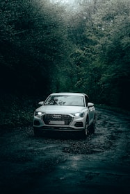 white audi car enjoying good wet grip in the rain driving on michelin energy tyres 