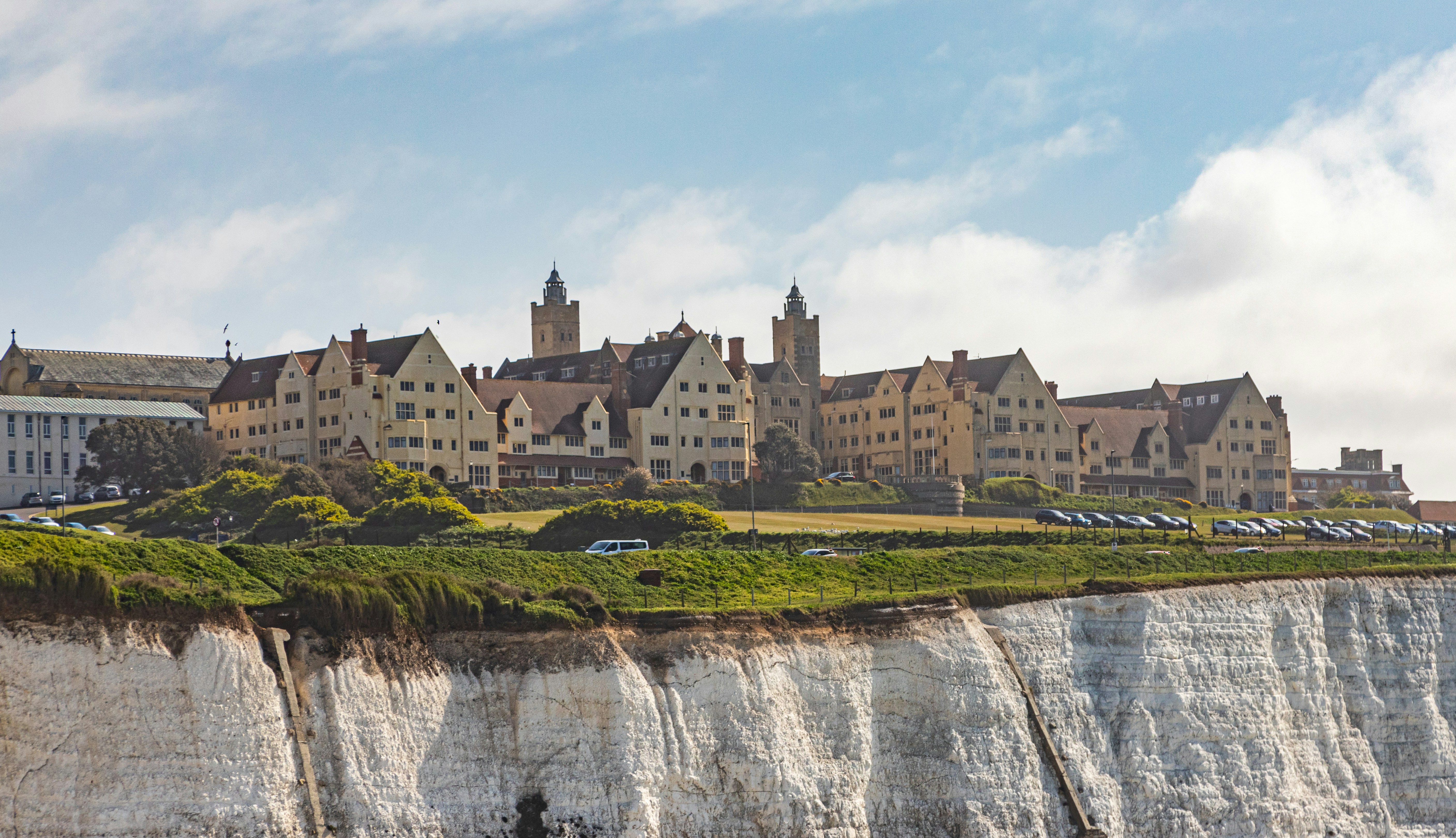 brown concrete building near waterfalls during daytime enchanting teams background