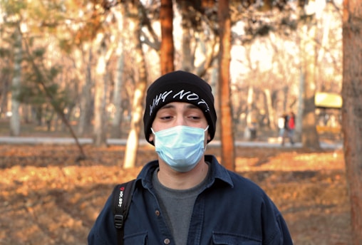 man in black adidas cap and black jacket