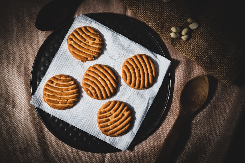 brown cookies on black and white polka dot textile