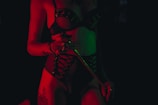 woman in red lingerie kneeling on floor