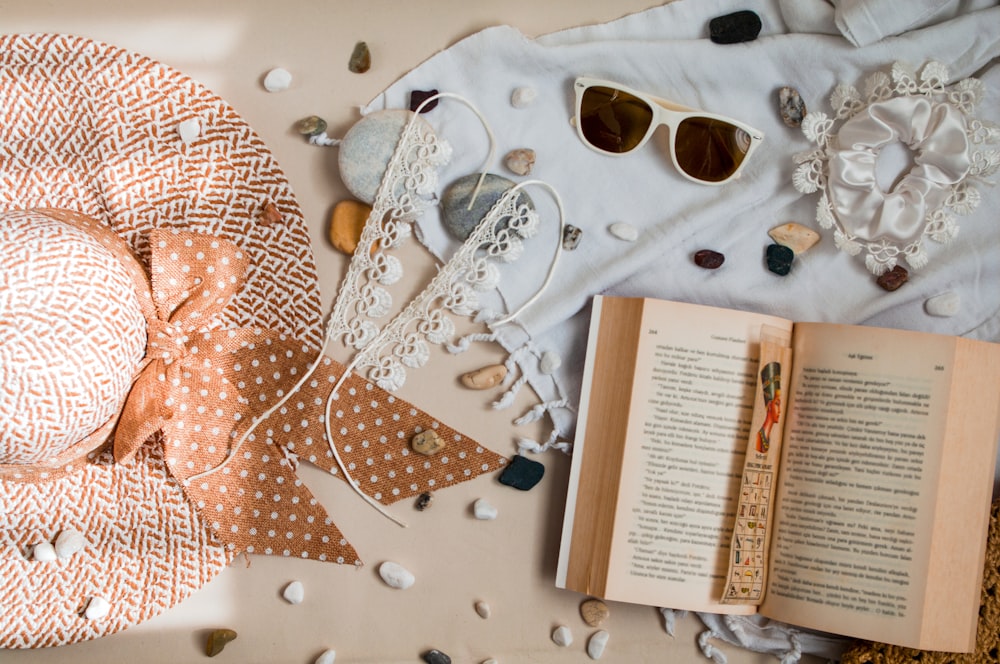 white framed sunglasses on white and brown polka dot textile